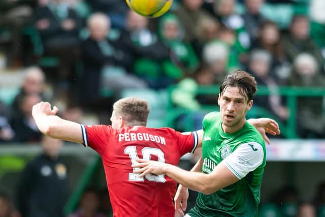 Joe Newell in the thick of it against Aberdeen as he challenges Dons midfielder Lewis Ferguson