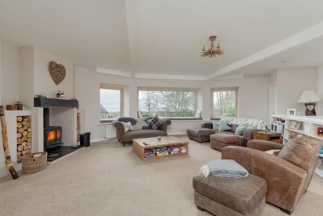 On the first floor there is a sitting room with additional wood burning stove and stunning uninterupted views towards the golf course and sea.