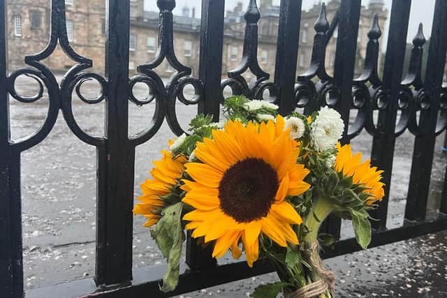 A flower tribute left for The Queen following her death