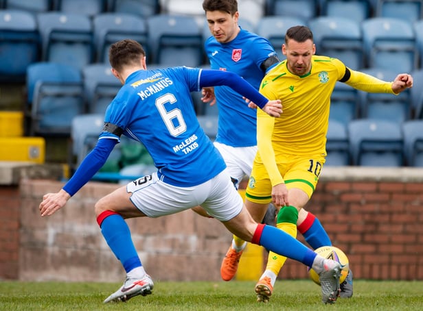 Hibs attacker Martin Boyle tries to evade the attentions of Stranraer defnder Connor McManus