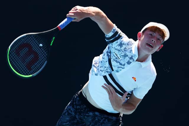 Matt Rankin serves in his first round junior boys singles match against Max Batyutenko of Kazakhstan at the Australian Open at Melbourne Park