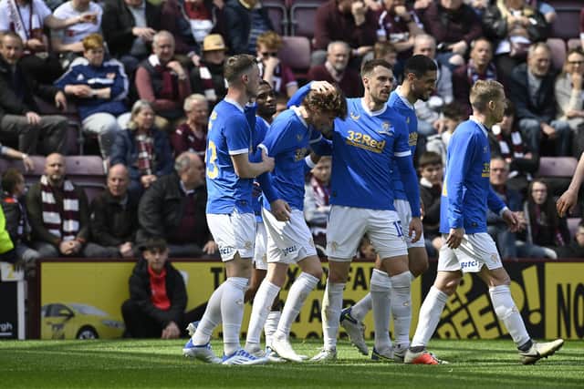 Alex Lowry celebrates with Aaron Ramsey after making it 2-1 to Rangers against Hearts at Tynecastle. Picture: SNS