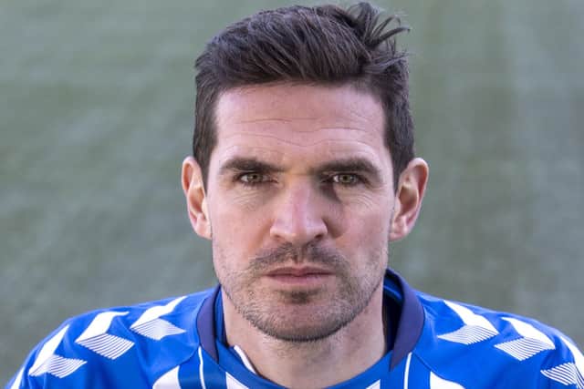 Kyle Lafferty has signed a new contract at Kilmarnock for their return to the Premiership