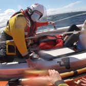Lifeboat crews rescue the stricken rower (Pic: Dunbar RNLI)