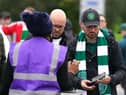 Celtic fans queue to show their vaccine passports as they enter the ground for the UEFA Europa League Group G match at Celtic Park, Glasgow.
