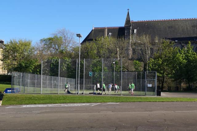 A group of eight footballers were pictured playing on Thursday evening outside the school.