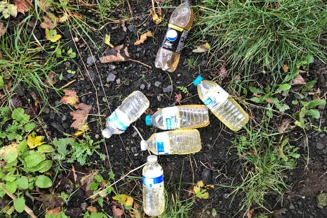 Some of the bottles of urine found by Tom