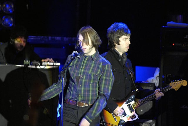 Kasabian frontman Tom Meighan on the Princes Street Gardens stage at Edinburgh Hogmanay 2008 with special guest Noel Gallagher from Oasis.