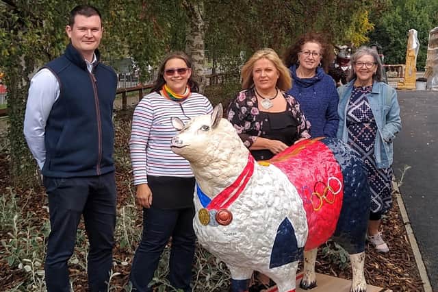 Aldi's Philip Johnston with Maria Campbell, Margaret Bititci, Bernadette Wood and  Mary Blair of Dalkeith Arts. Pictured with the fibre glass sheep 'Baaacking Team GB'.