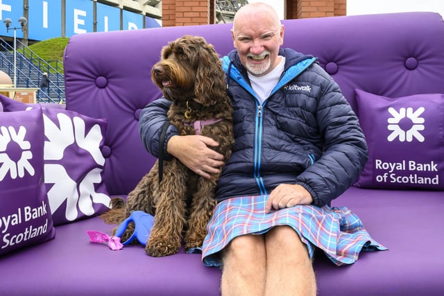 Sir Tom Hunter and and dog Frank at this year's Edinburgh Kiltwalk, pictured at the finish line at Murrayfield Stadium.