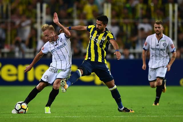 Jeggo, left, vies for the ball with Alper Potuk of Fenerbahce during Sturm Graz's UEFA Europa League third qualifying round clash in August 2017