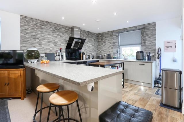Here is our first look at the high-specification kitchen, which boasts integrated Neff appliances and solid quartz worktops. It has a modern and stylish feel.