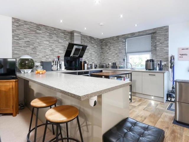 Here is our first look at the high-specification kitchen, which boasts integrated Neff appliances and solid quartz worktops. It has a modern and stylish feel.