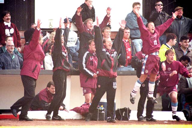 The Hearts coaching staff and substitutes celebrate Allan Johnston's late winner. Picture: SNS