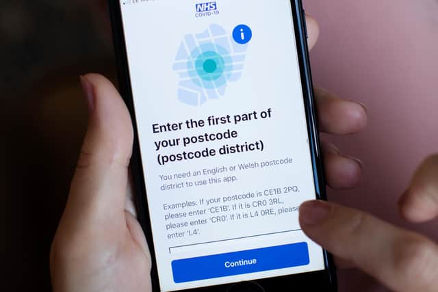 The UK government's test and trace application displayed on a handheld device
