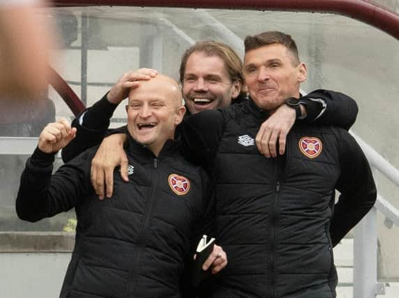 Hearts' coaching staff celebrate at Tynecastle.