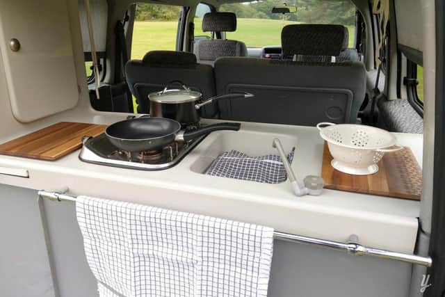 A mini kitchen at the back of the van means cooking can take place inside and out, depending on the weather.