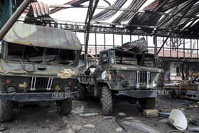 Damaged Ukrainian Army military trucks are parked at the Illich Iron & Steel Works Metallurgical Plant, the second largest metallurgical enterprise in Ukraine, in an area controlled by Russian-backed separatist forces in Mariupol. (AP Photo/Alexei Alexandrov)