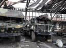 Damaged Ukrainian Army military trucks are parked at the Illich Iron & Steel Works Metallurgical Plant, the second largest metallurgical enterprise in Ukraine, in an area controlled by Russian-backed separatist forces in Mariupol. (AP Photo/Alexei Alexandrov)