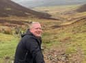 Tom is climbing the Pentland Hills 16 times, equivalent to the height of Everest