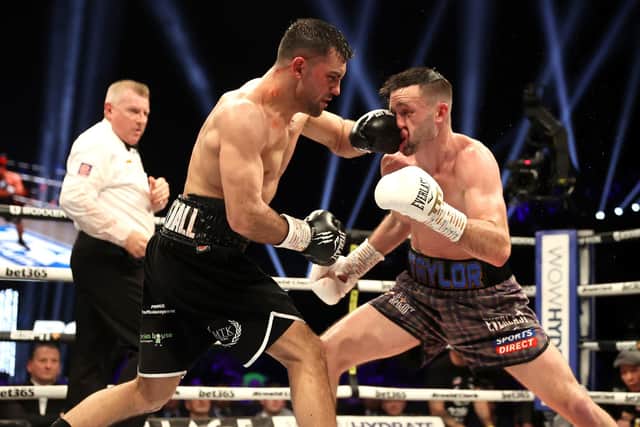 Jack Catterall lands a big shot against Josh Taylor in the light welterweight bout at the OVO Hydro in Glasgow