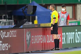 Referee Georgi Kabakov consults the VAR monitor during the World Cup qualifier between Austria and Scotland last month. Picture: SNS