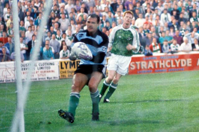 Hibs goalkeeper John Burridge (left) gathers the ball as teammate Graham Mitchell covers in the Skol Cup quarter-final win over Ayr United at Somerset Park in 1991.
