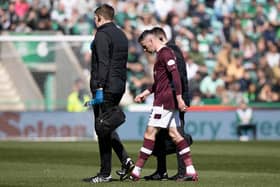 Hearts defender Michael Smith was forced off with an injury against Hibs on Saturday.