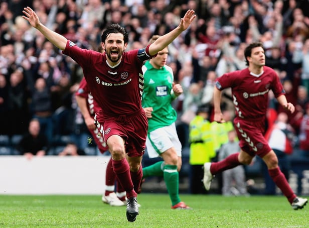 Hearts' Paul Hartley wheels away in celebration after netting against rivals Hibs at Hampden in April 2006