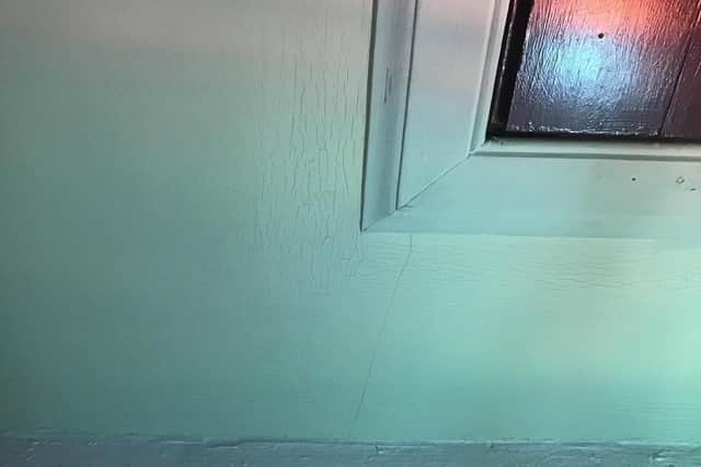 Pictures show cracks in the wall that resident's say is caused by the heavy traffic going over speed bumps on the street outside.