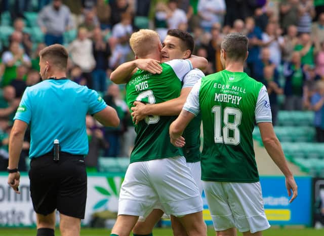 Kyle Magennis embraces Josh Doig during Hibs' 3-0 win over Ross County.