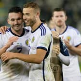 Ryan Porteous and former Hibs teammate John McGinn at full time after Scotland's 0-0 draw with Ukraine in Krakow, Poland, which was enough to win Nations League Group B1. Picture: Craig Williamson / SNS