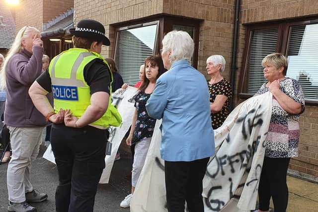 Residents staged a peaceful demonstration outside a block of flats where convicted child sex offender Graham Brown has been placed by the local authority in Musselburgh.