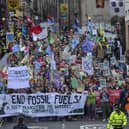 End Fossil Fuels Scotland demonstrators held a protest in Edinburgh yesterday. Marching from the Mound to the Scottish Parliament. Here they are pictured marching down the Royal Mile towards Holyrood.