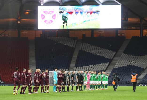 Hearts and Hibernian players line up prior to kick-off during the William Hill Scottish Cup semi final match at Hampden Park, Glasgow.