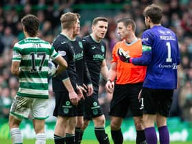 Hibs players appeal to referee Steven McLean during the 3-1 defeat by Celtic