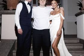Lewis Capaldi posing with the happy couple.
