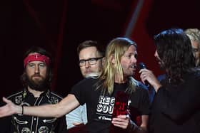 Taylor Hawkins and Dave Grohl of Foo Fighters accepting the award for Best International Group during the 2018 BRIT Awards show, held at the O2 Arena, London.
