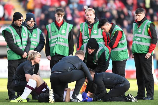 Peter Haring receives treatment after being knocked out during Hearts' 2-0 defeat to Aberdeen in October. Picture: SNS
