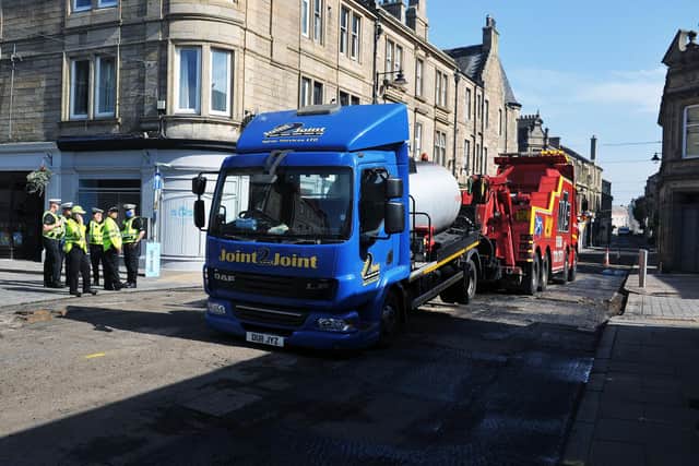 A lorry was towed away following a collision in Bo'ness this morning which left a woman with "life-threatening injuries". Picture: Michael Gillen.