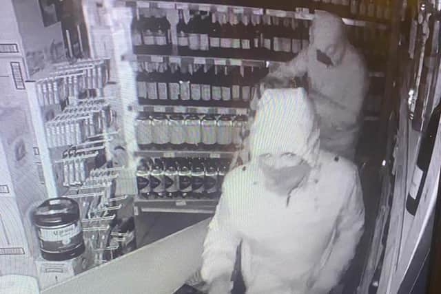 An image from CCTV footage captures the two masked thieves breaking into the Day-Today convenience stores in Drylaw (Photo: Zahid Iqbal).