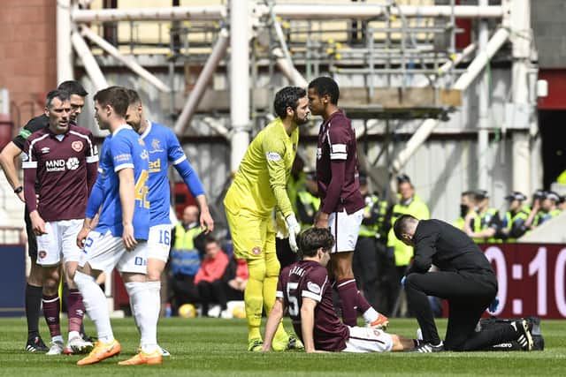 Peter Haring receives treatment for an injury during the second half of Hearts' defeat to Rangers. Picture: SNS