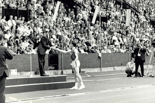 The final handover of the Commonwealth Baton Relay at the opening of the 1970 Games.