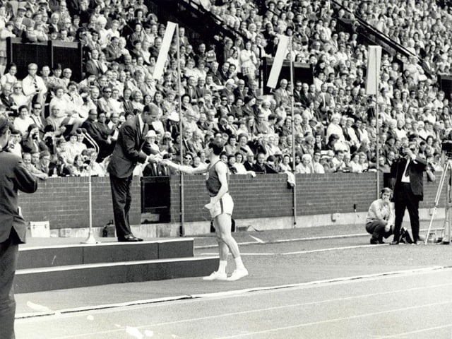 The final handover of the Commonwealth Baton Relay at the opening of the 1970 Games.