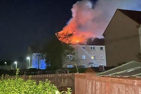 Six people have been taken to hospital after a fire broke out in top story flat in Loanhead,  Edinburgh, early this morning.