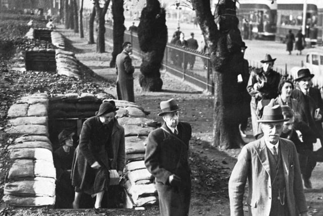 People leaving the underground air raid shelters in East Princes Street Gardens, Edinburgh after the all-clear sounds during World War II (May 1945).