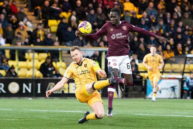 Livingston's Nicky Devlin stops Garang Kuol as the speedy hearts sub advances towards goal. The Australian's pace caused Livi problems. Picture: Ross Parker / SNS