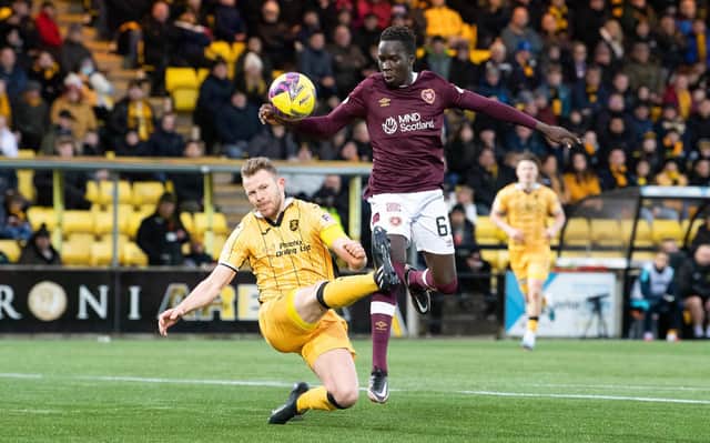 Livingston's Nicky Devlin stops Garang Kuol as the speedy hearts sub advances towards goal. The Australian's pace caused Livi problems. Picture: Ross Parker / SNS