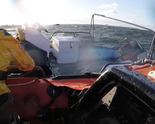 The crew spotted the small boat struggling in choppy waters and blustery conditions
