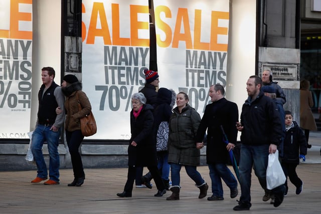 Shops on Princes street advertising their New Year sales in January 2016.